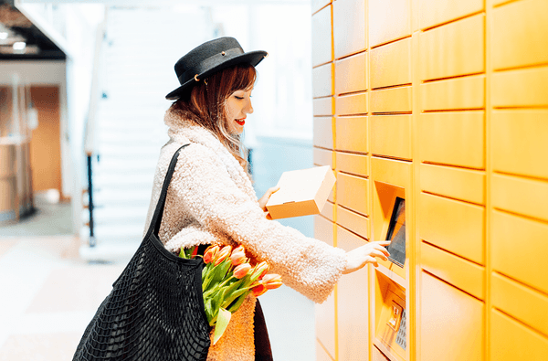 Lady opening Amazon locker.