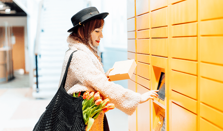 Lady opening Amazon locker.